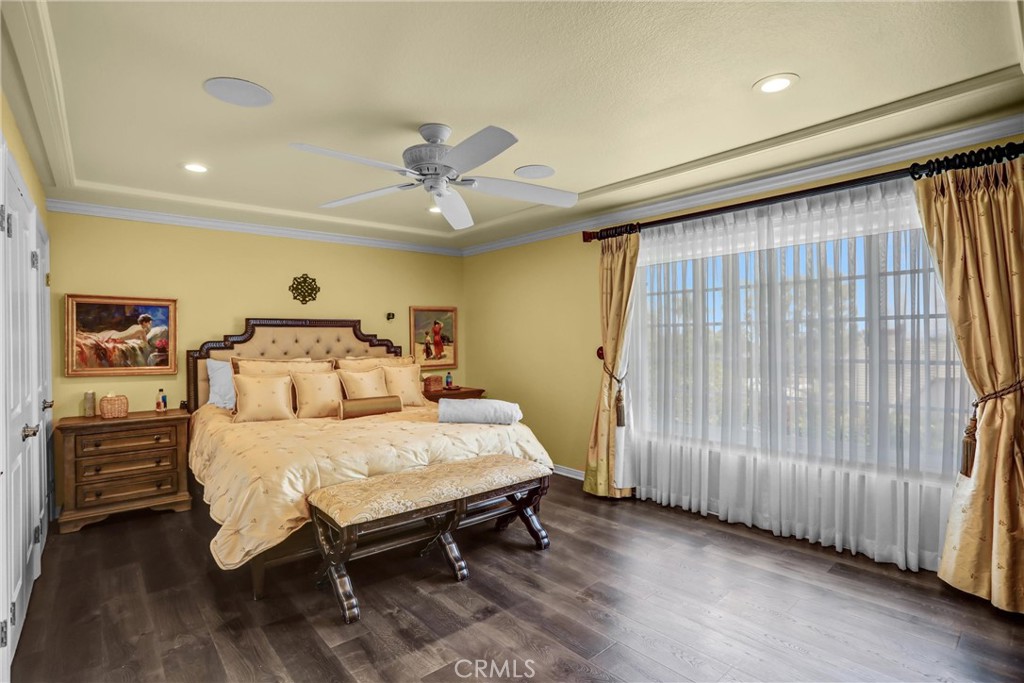 5787 Ridgeway Road Rancho Cucamonga, CA 91701 - Photo 28 of 56 a bedroom with a bed and a chandelier