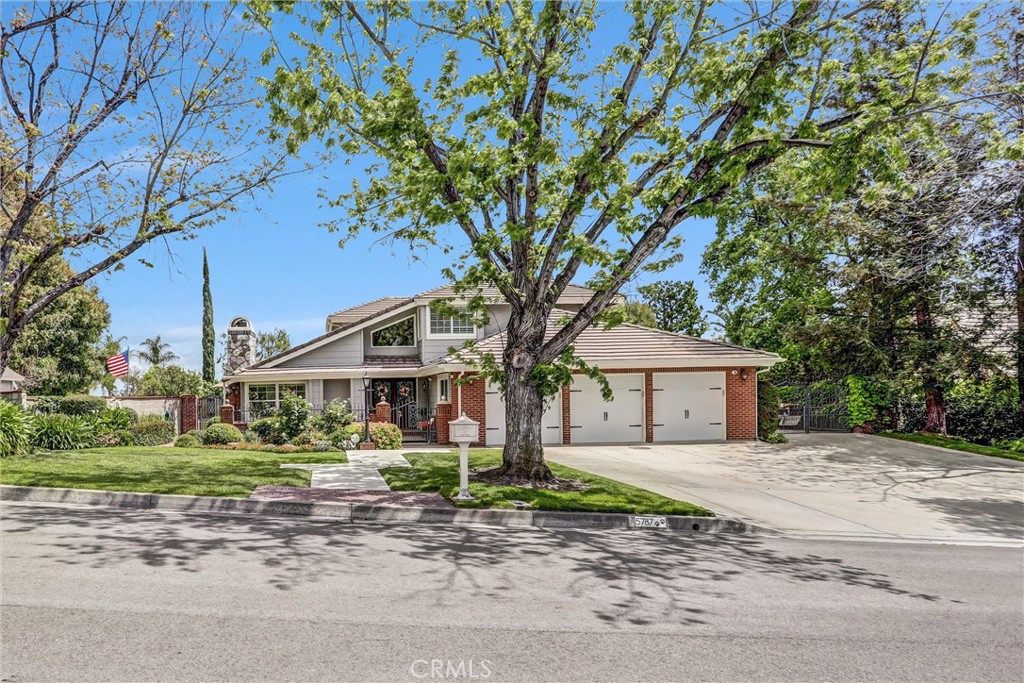 5787 Ridgeway Road Rancho Cucamonga, CA 91701 - Photo 3 of 56 a front view of a house with a garden