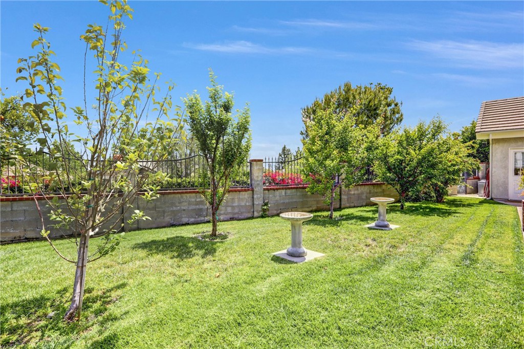 5787 Ridgeway Road Rancho Cucamonga, CA 91701 - Photo 39 of 56 a backyard of a house with swimming pool and outdoor seating