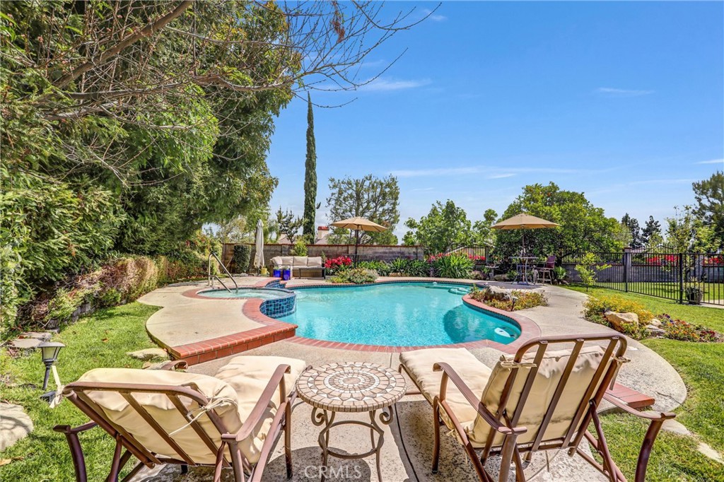 5787 Ridgeway Road Rancho Cucamonga, CA 91701 - Photo 41 of 56 a view of a swimming pool with lounge chairs