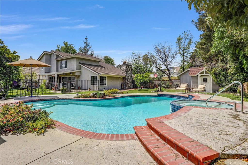 5787 Ridgeway Road Rancho Cucamonga, CA 91701 - Photo 43 of 56 a front view of house with yard and swimming pool