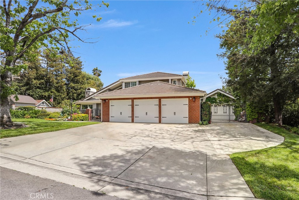5787 Ridgeway Road Rancho Cucamonga, CA 91701 - Photo 5 of 56 a large house with a big yard and large trees