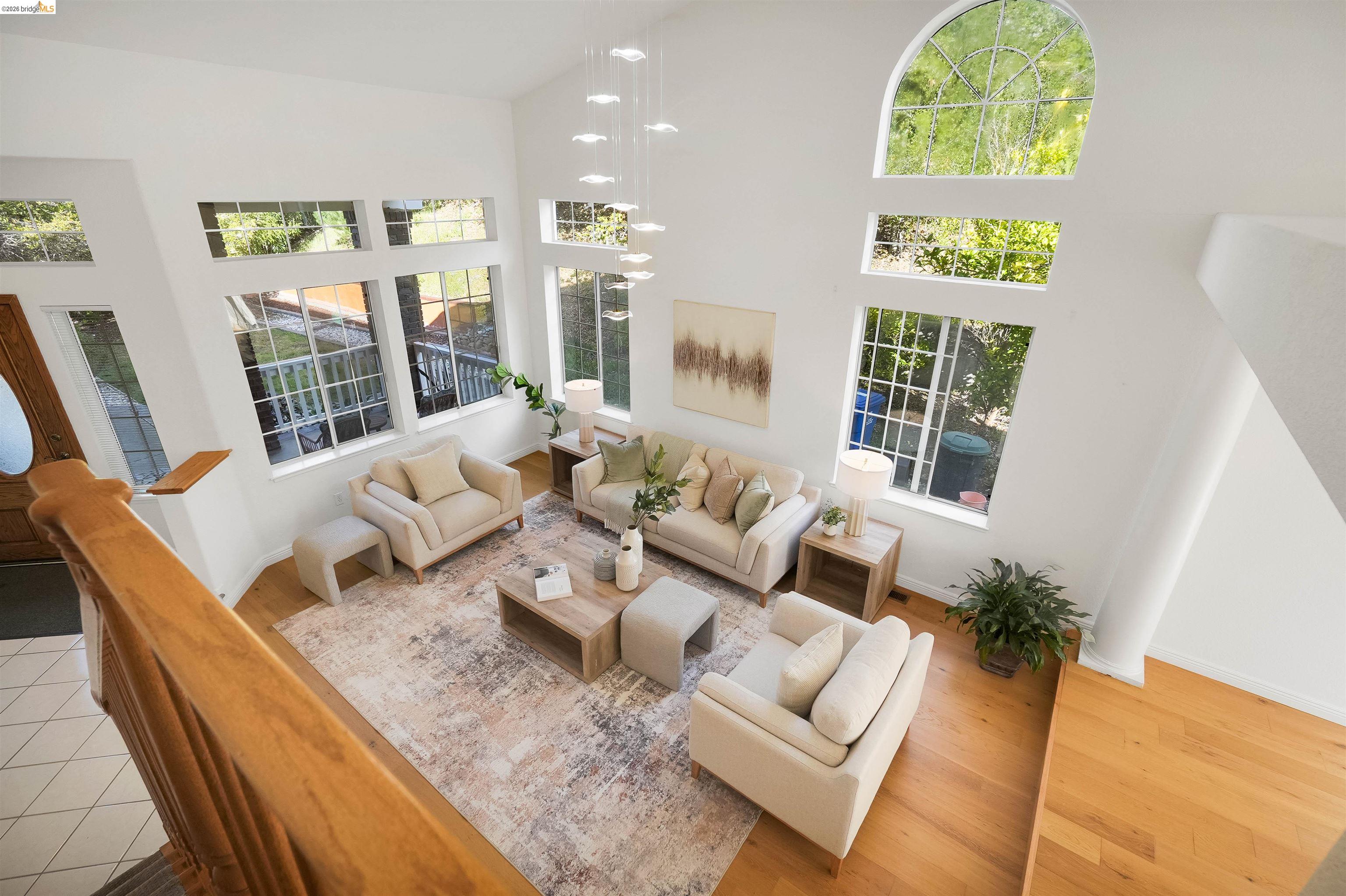 4080 Woodstock Road Hayward, CA 94542 - Photo 6 of 52 Living room featuring light wood finished floors and vaulted ceiling