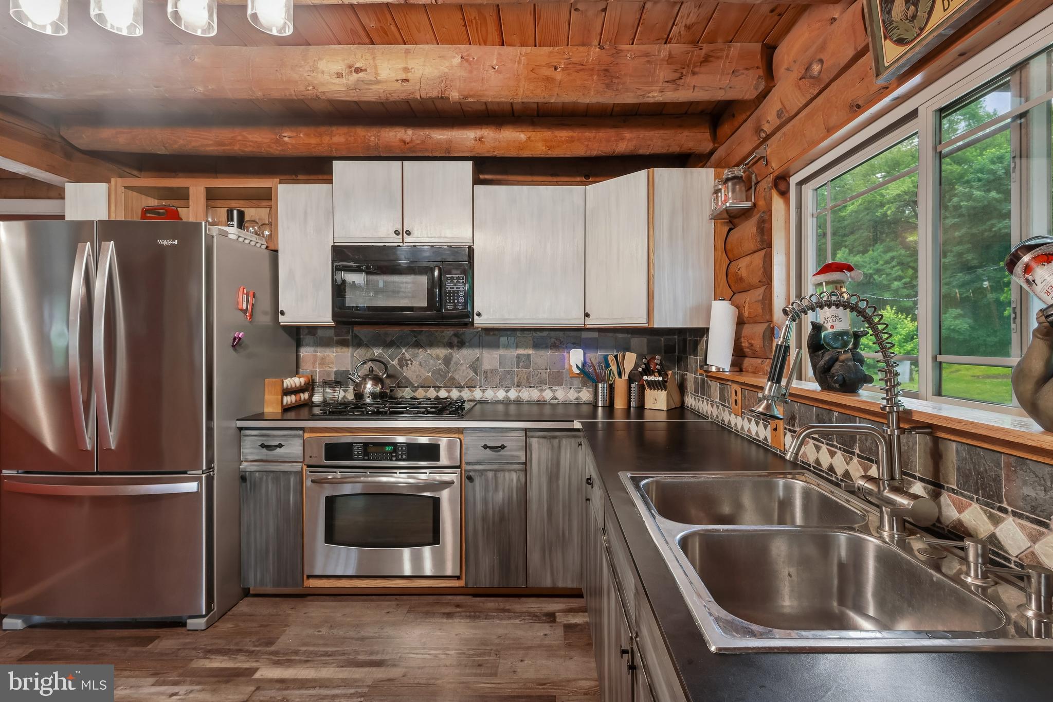 116 Mulberry Street Delran, NJ 08075 - Photo 6 of 32 a kitchen with a stove a sink and a refrigerator
