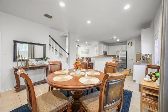a view of a dining room and a table and chairs