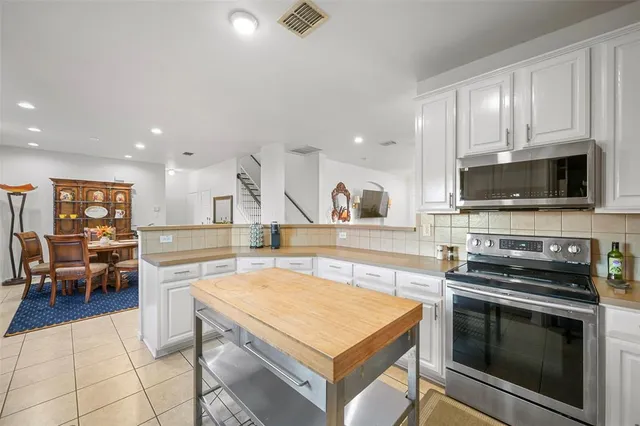 a kitchen with a stove and a microwave
