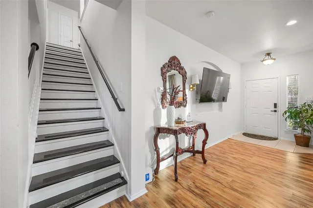 a view of a livingroom with furniture and staircase