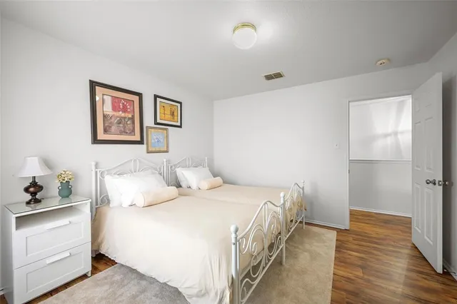 a bedroom with a bed and a walk in closet