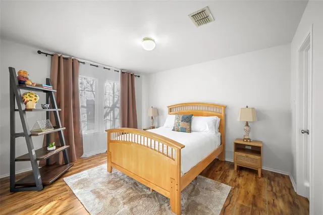 a bedroom with a bed and a book shelf