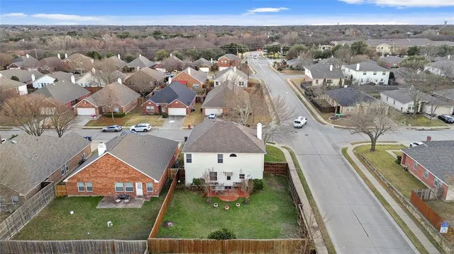an aerial view of a house with a garden