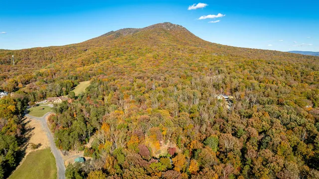 a very nice looking living room with furniture and a large window
