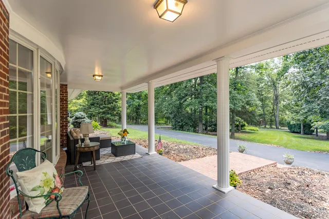 a front view of house with yard and trees