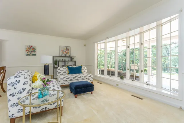 a reading room with furniture and a window