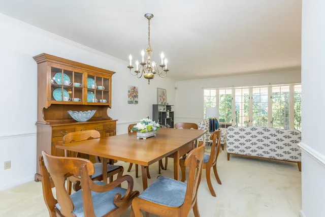 a view of a livingroom with furniture and a chandelier