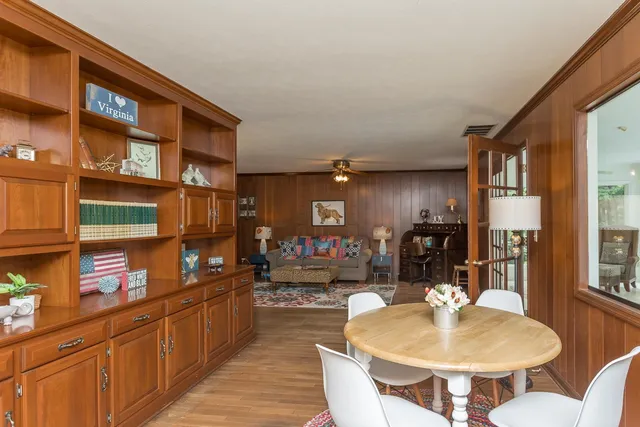 a front view of house with yard and trees