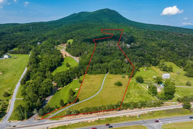 a front view of a house with outdoor seating