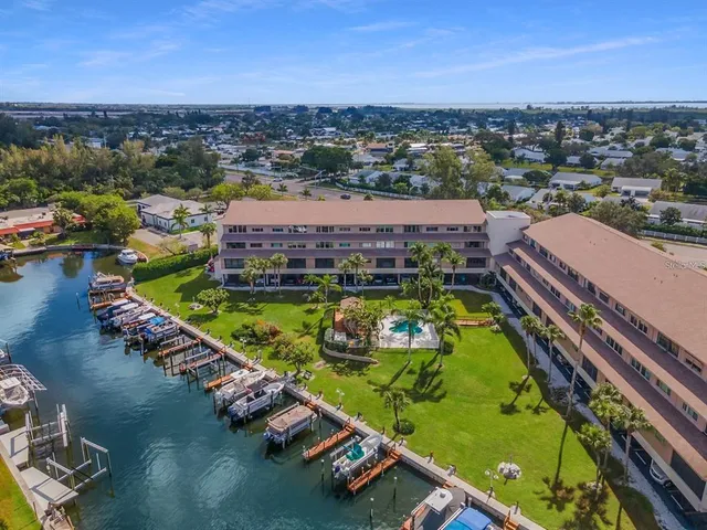 an aerial view of a resort with a swimming pool