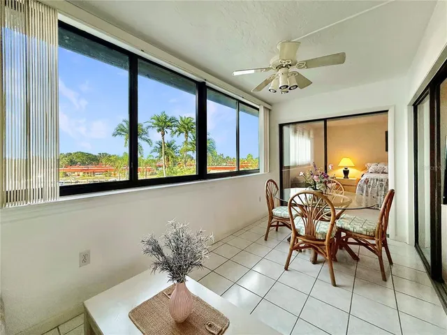 a view of a dining room with furniture window and outside view