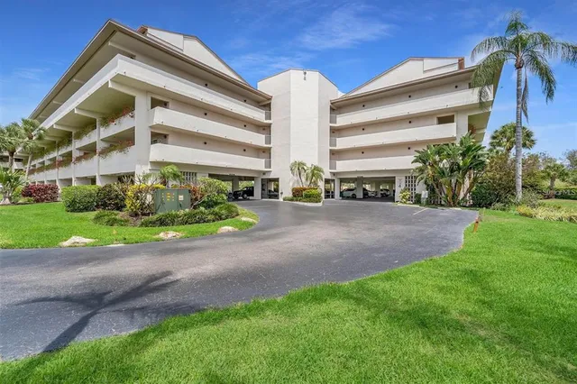 a view of a house with a yard and plants