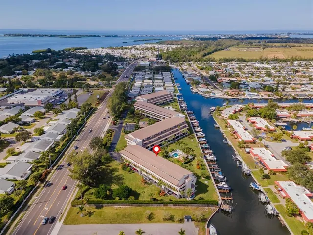 an aerial view of residential building and ocean