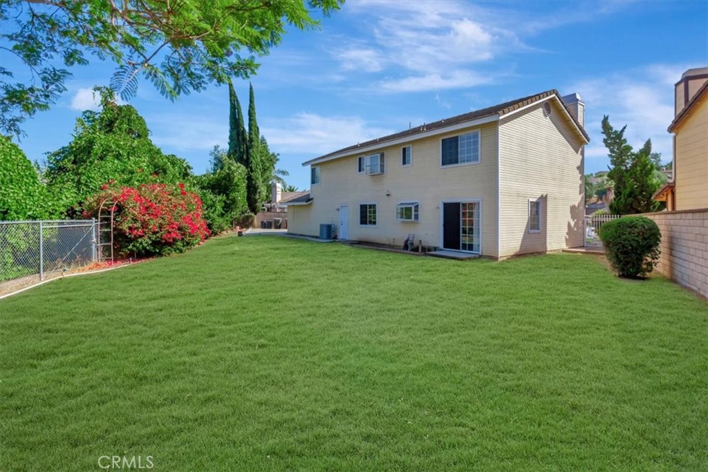 20210 Dickson Court Walnut, CA 91789 - Photo 23 of 26 Backyard with Virtual Staging Green Grass.