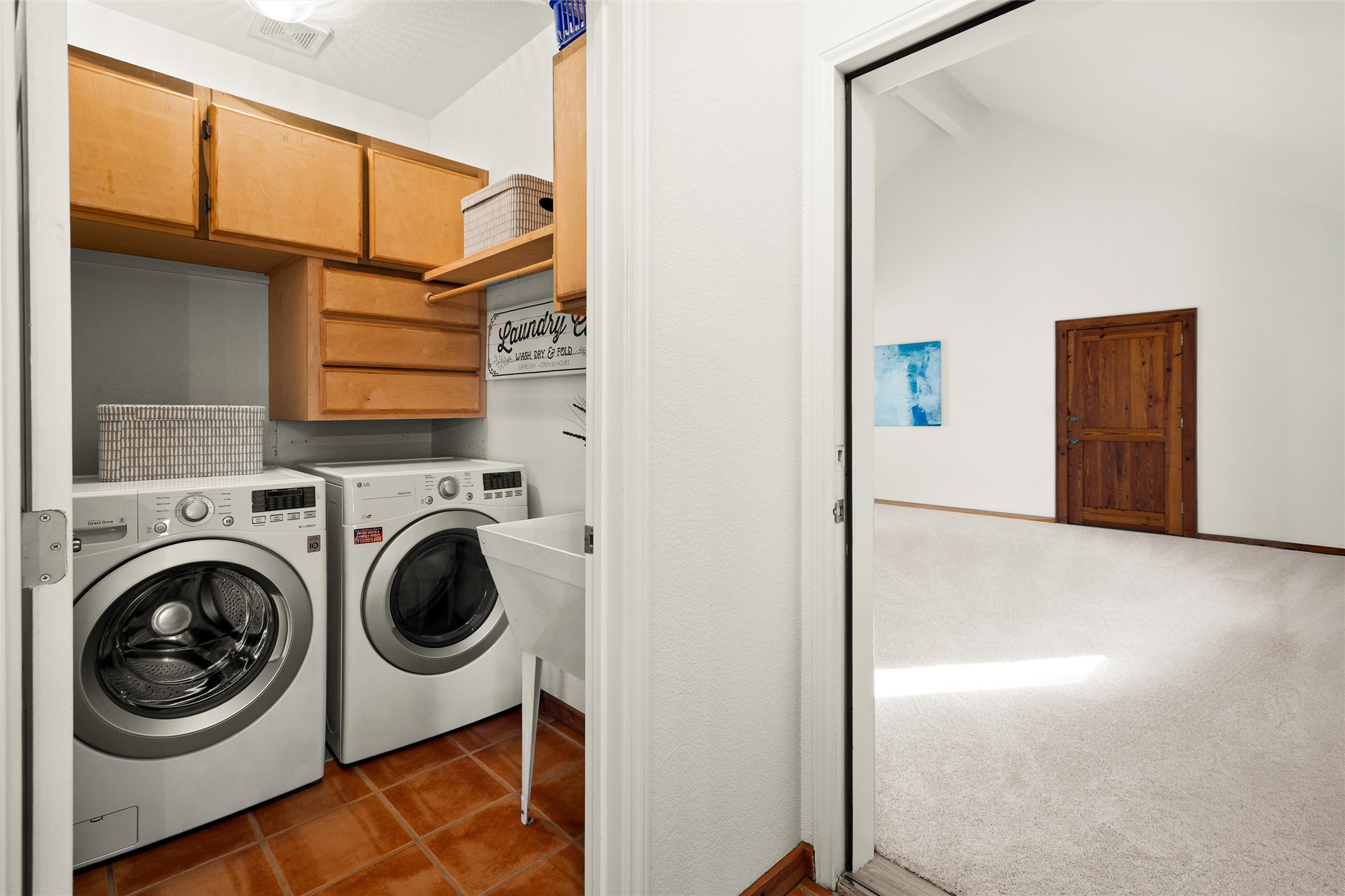 300 Sundown Ridge Austin, TX 78737 - Photo 26 of 40 a view of a hallway with washer and dryer