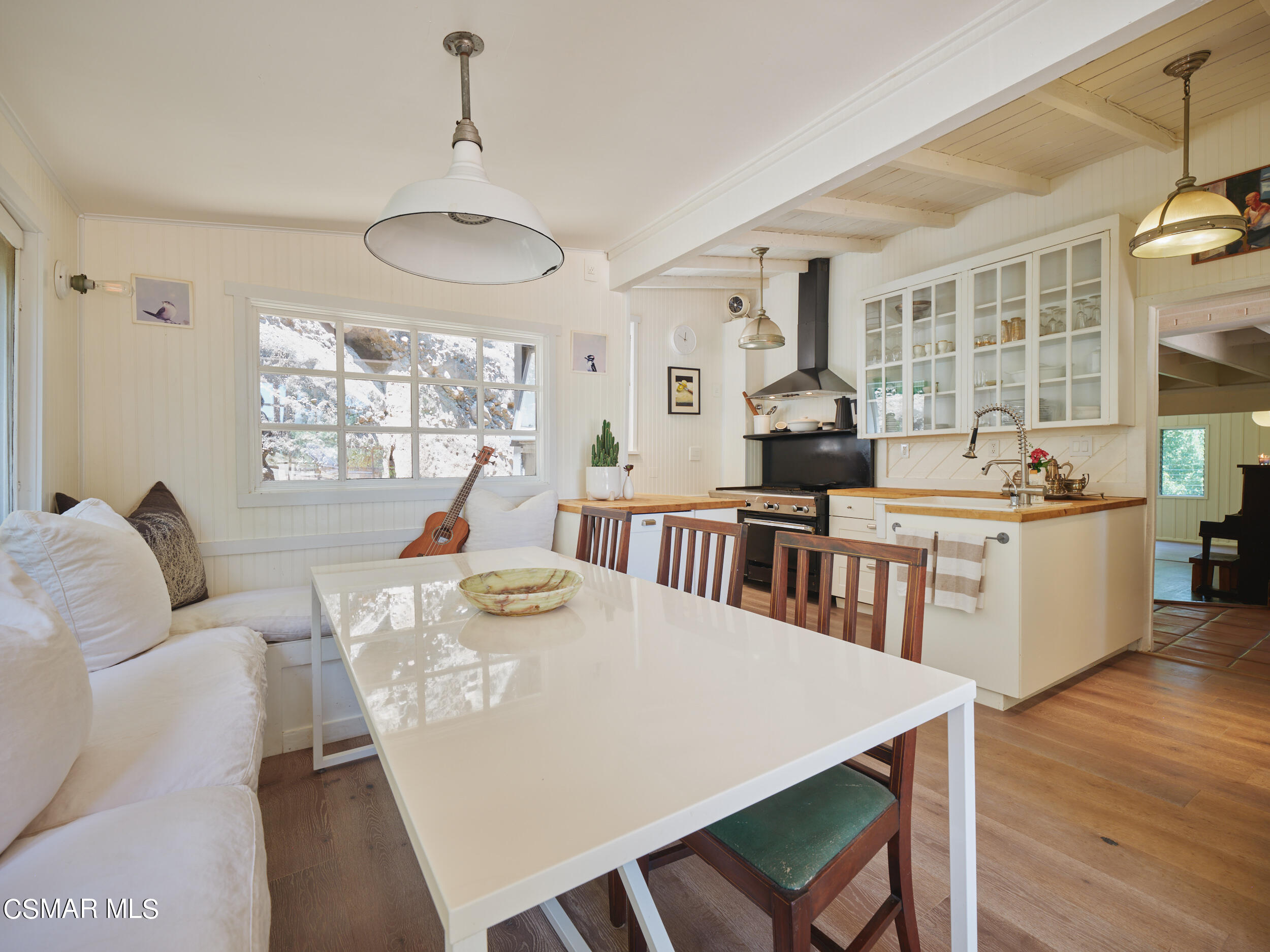 19833 Observation Drive Topanga, CA 90290 - Photo 18 of 75 a view of a dining room with furniture window and wooden floor