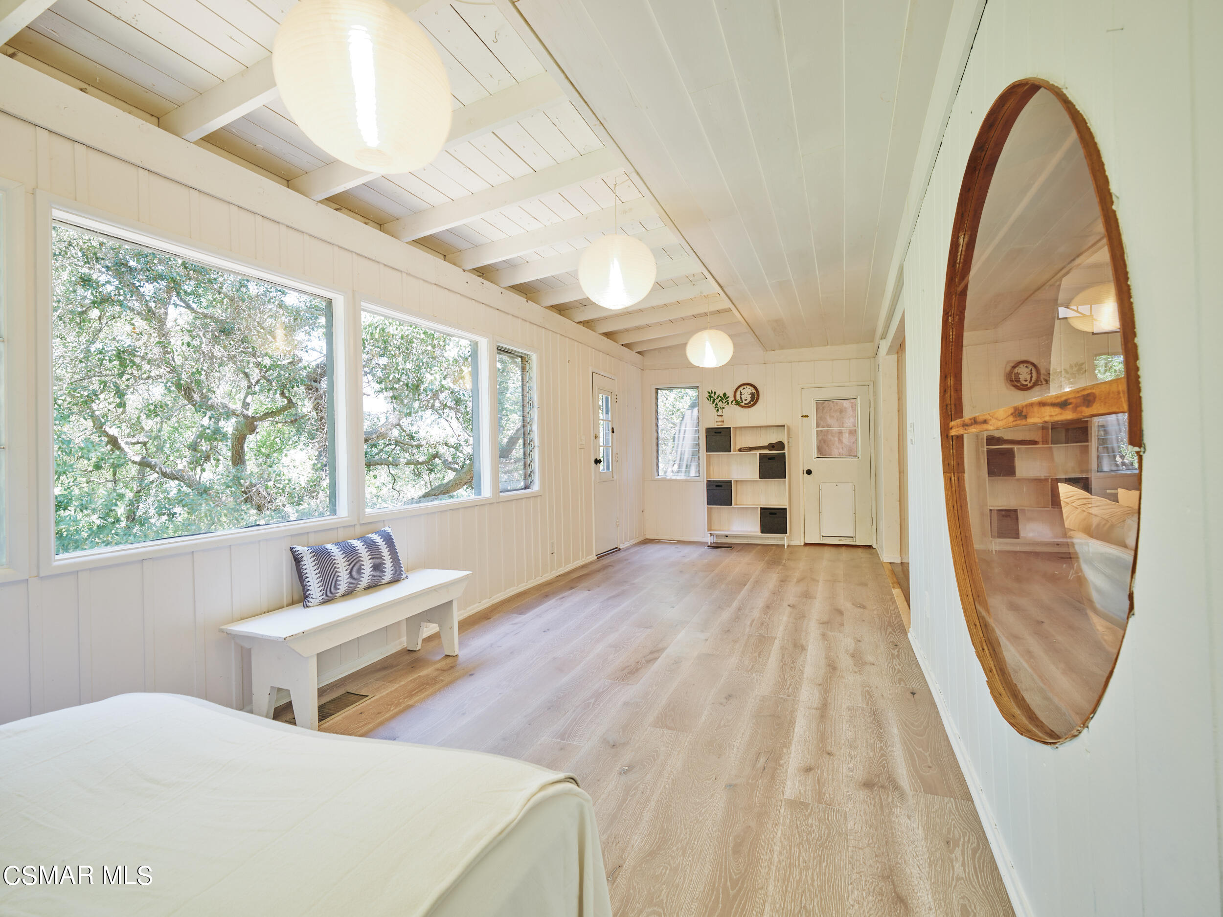 19833 Observation Drive Topanga, CA 90290 - Photo 25 of 75 a spacious bedroom with two beds and a large window