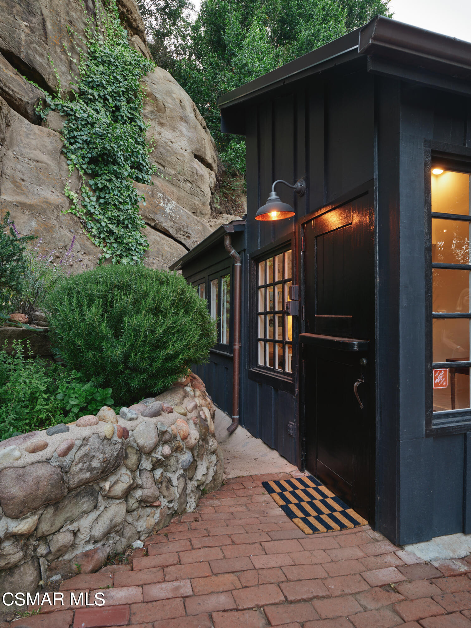 19833 Observation Drive Topanga, CA 90290 - Photo 3 of 75 a backyard of a house with large trees and wooden fence