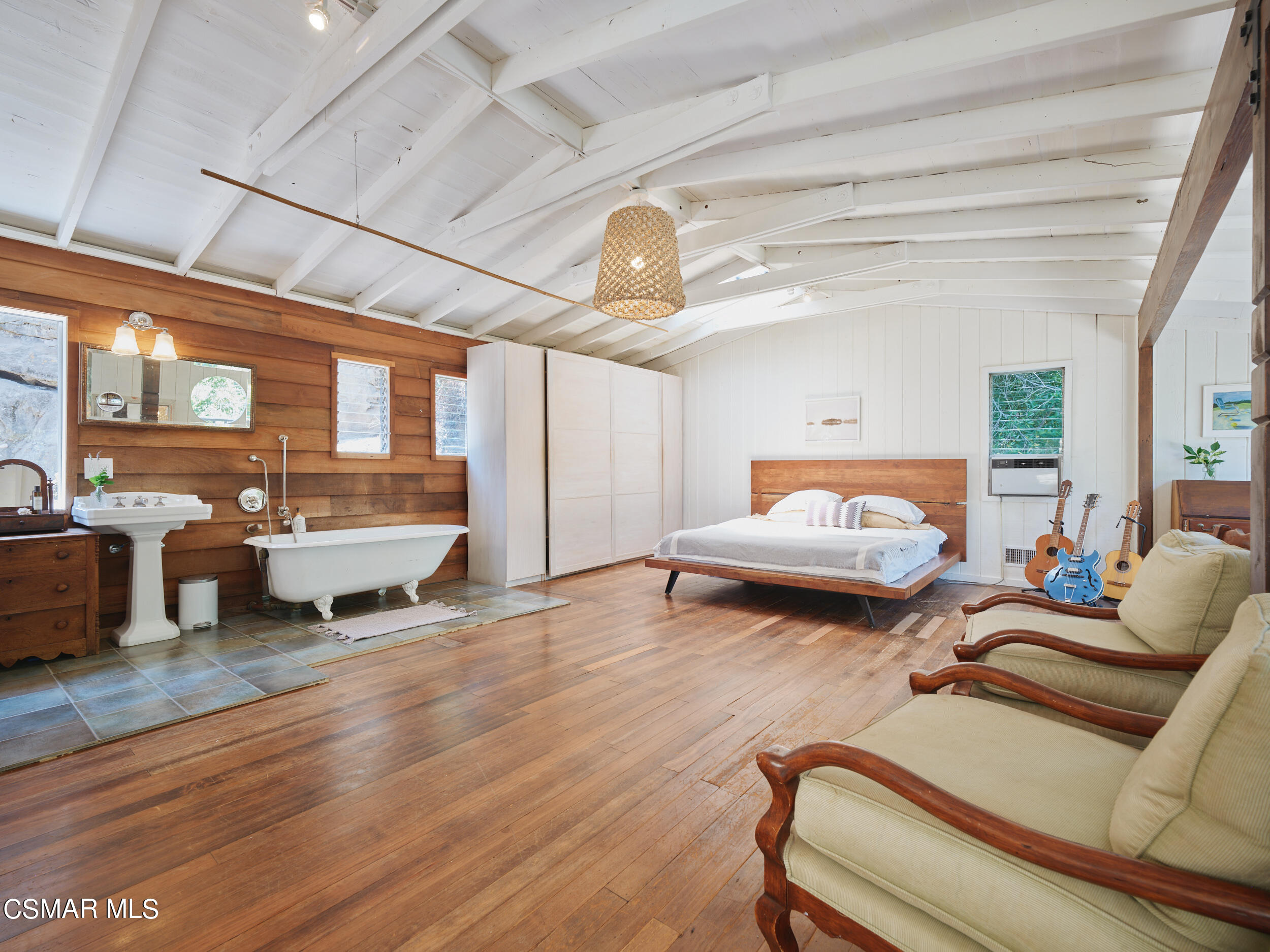 19833 Observation Drive Topanga, CA 90290 - Photo 32 of 75 a living room with furniture and a chandelier