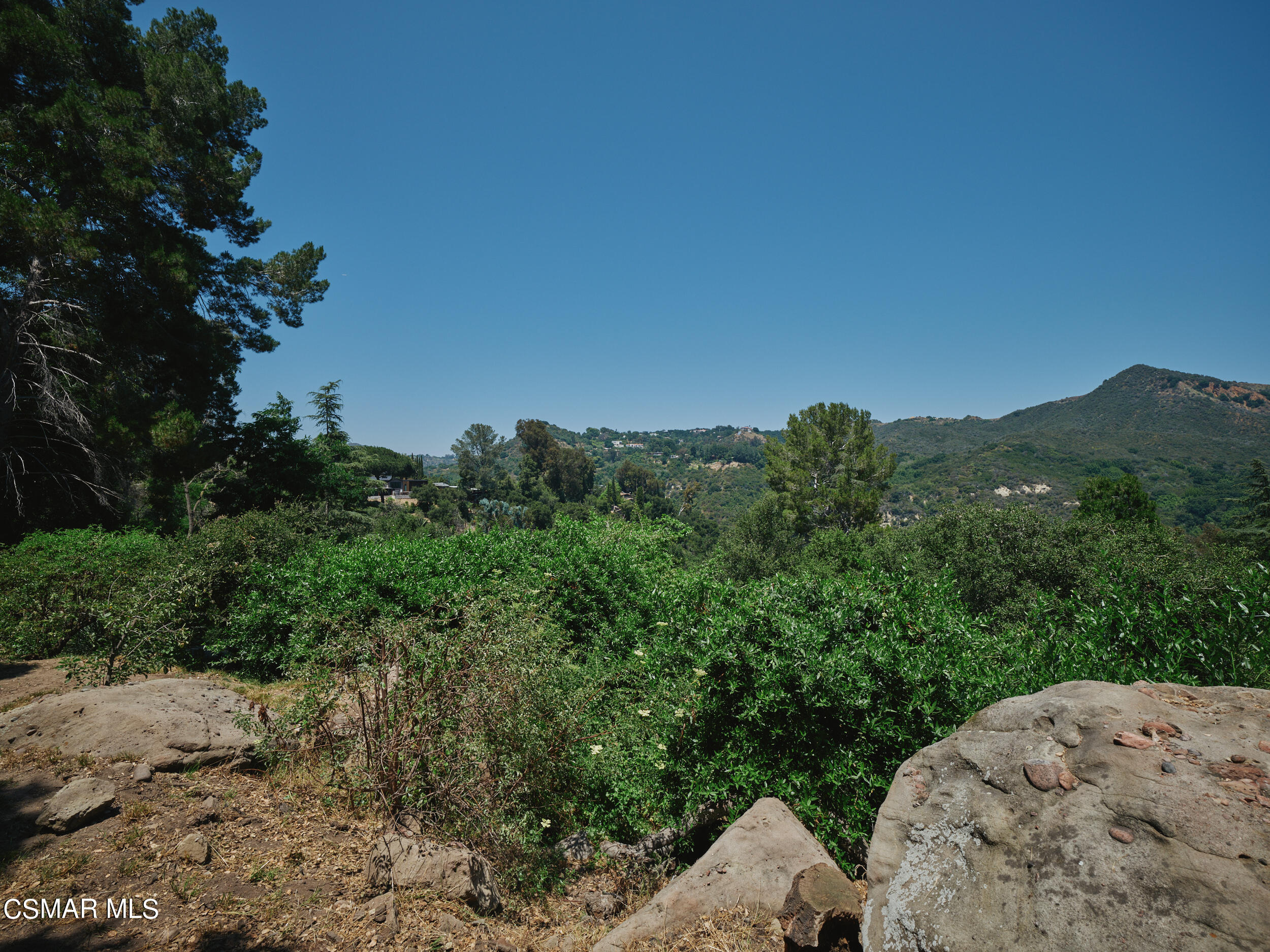 19833 Observation Drive Topanga, CA 90290 - Photo 64 of 75 a view of a big yard with a mountain