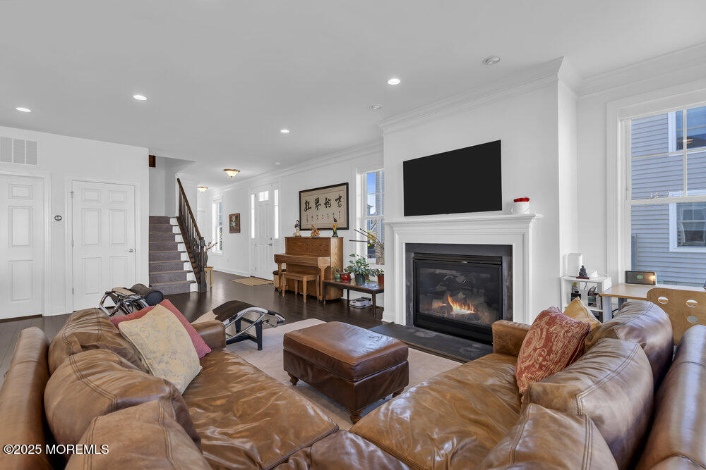 26 Malcolm Way Lincroft, NJ 07738 - Photo 11 of 44 a living room with furniture or fireplace and a flat screen tv