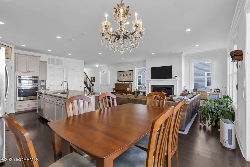 26 Malcolm Way Lincroft, NJ 07738 - Photo 15 of 44 a view of a dining room with furniture window and wooden floor