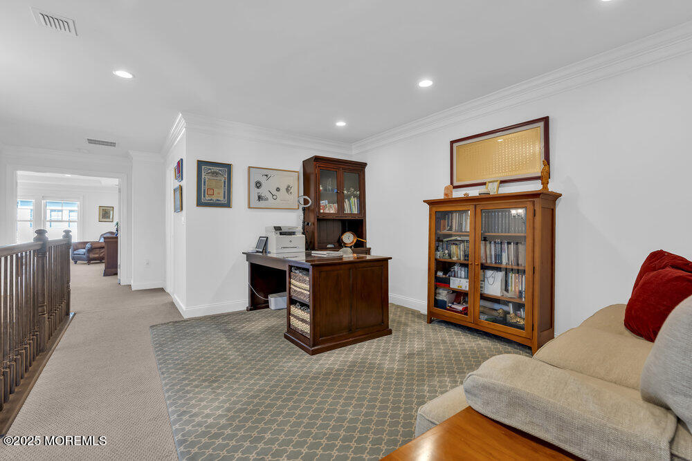 26 Malcolm Way Lincroft, NJ 07738 - Photo 23 of 44 a living room with furniture and a flat screen tv