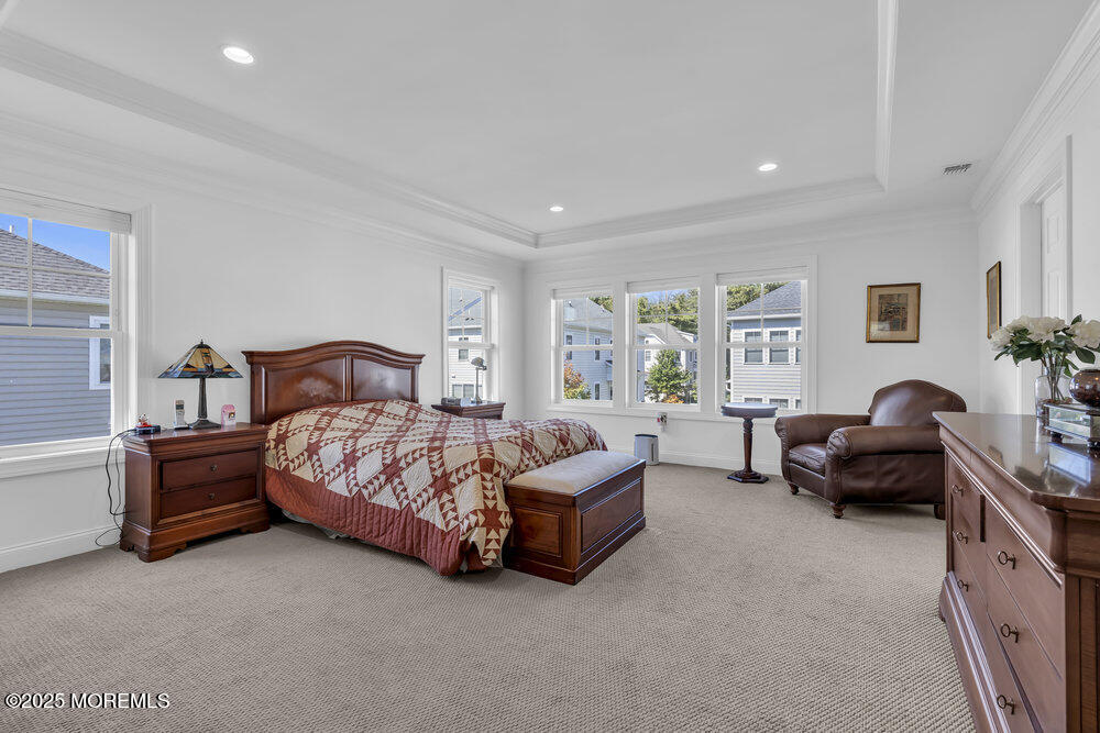 26 Malcolm Way Lincroft, NJ 07738 - Photo 25 of 44 a bedroom with a bed couch and a window
