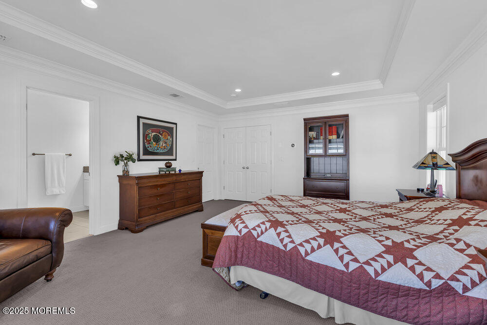 26 Malcolm Way Lincroft, NJ 07738 - Photo 26 of 44 a bedroom with a bed and a couch