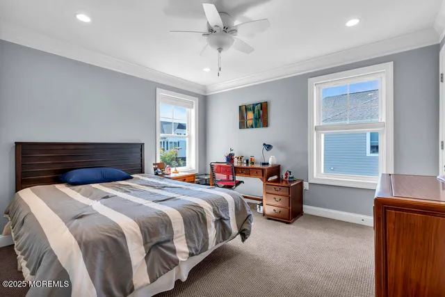 a living room with a bed furniture and a window