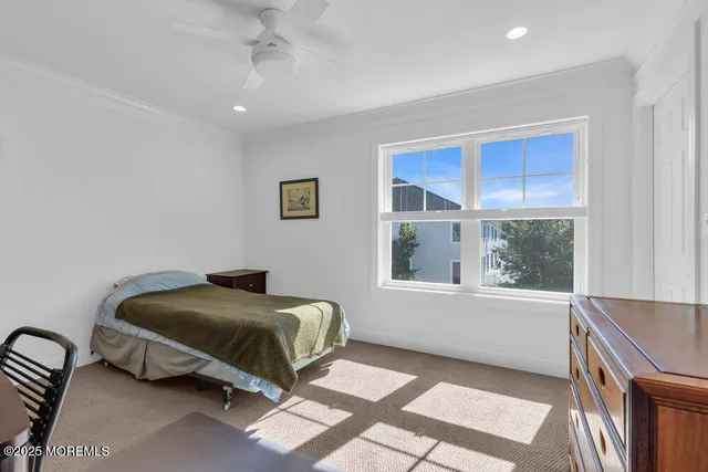 a bathroom with a granite countertop sink a toilet and a mirror