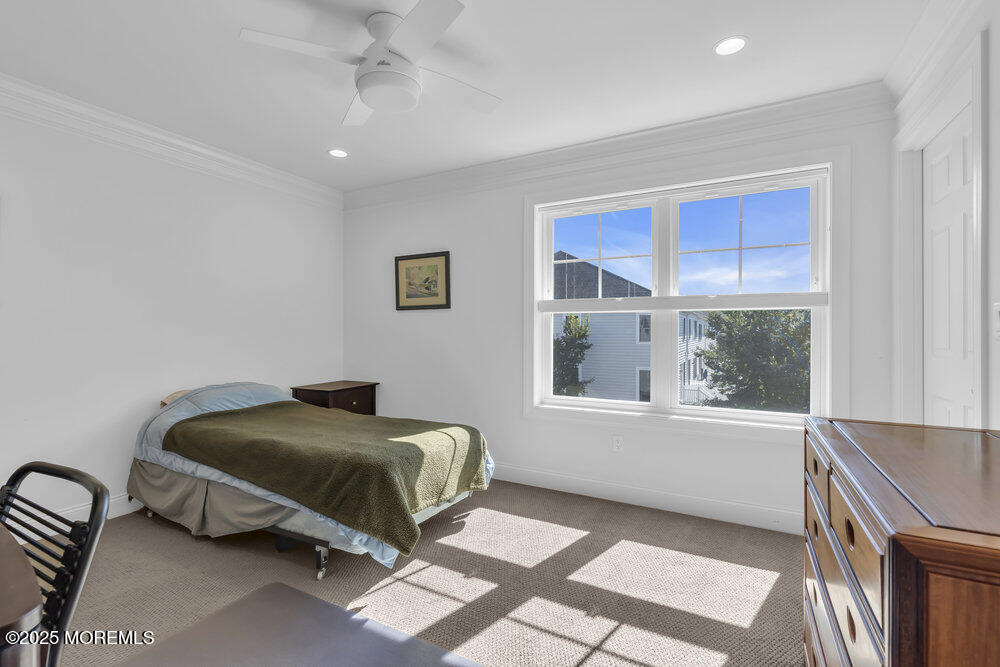 26 Malcolm Way Lincroft, NJ 07738 - Photo 31 of 44 a living room with a bed furniture and a window