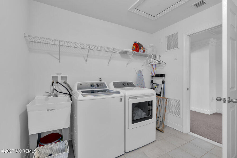 26 Malcolm Way Lincroft, NJ 07738 - Photo 33 of 44 a utility room with dryer and washer