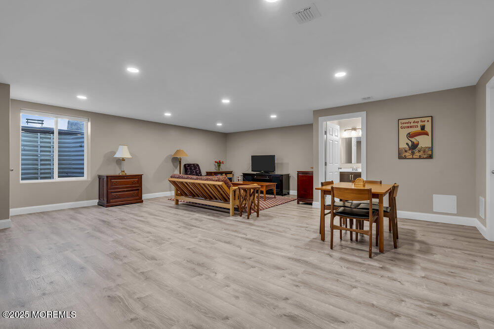 26 Malcolm Way Lincroft, NJ 07738 - Photo 34 of 44 a living room with furniture and a wooden floor