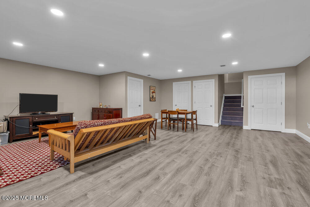 26 Malcolm Way Lincroft, NJ 07738 - Photo 35 of 44 a living room with furniture and a flat screen tv