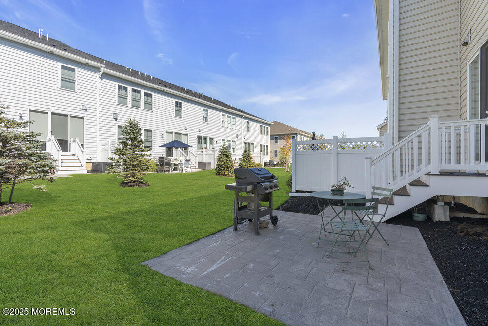 26 Malcolm Way Lincroft, NJ 07738 - Photo 38 of 44 a view of a patio with chairs and plants