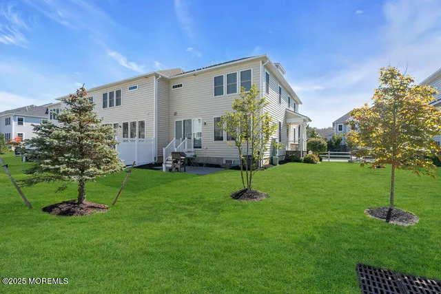 an aerial view of multiple houses with outdoor space