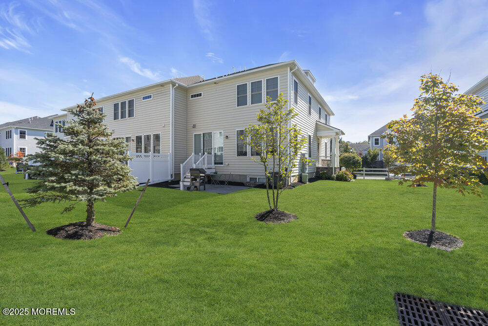 26 Malcolm Way Lincroft, NJ 07738 - Photo 39 of 44 a front view of a house with a garden
