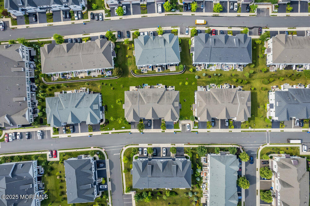 26 Malcolm Way Lincroft, NJ 07738 - Photo 40 of 44 an aerial view of multiple houses with outdoor space