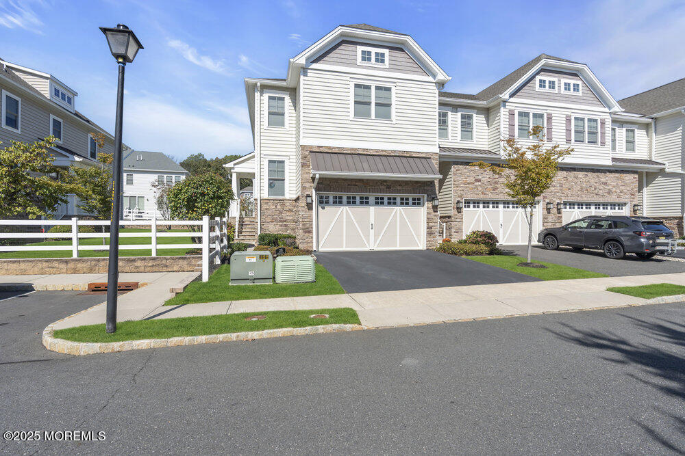 26 Malcolm Way Lincroft, NJ 07738 - Photo 4 of 44 a front view of a house with a yard