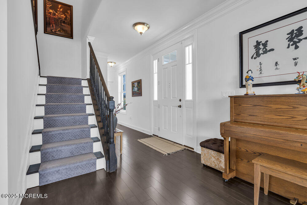26 Malcolm Way Lincroft, NJ 07738 - Photo 6 of 44 a view of entryway with wooden floor