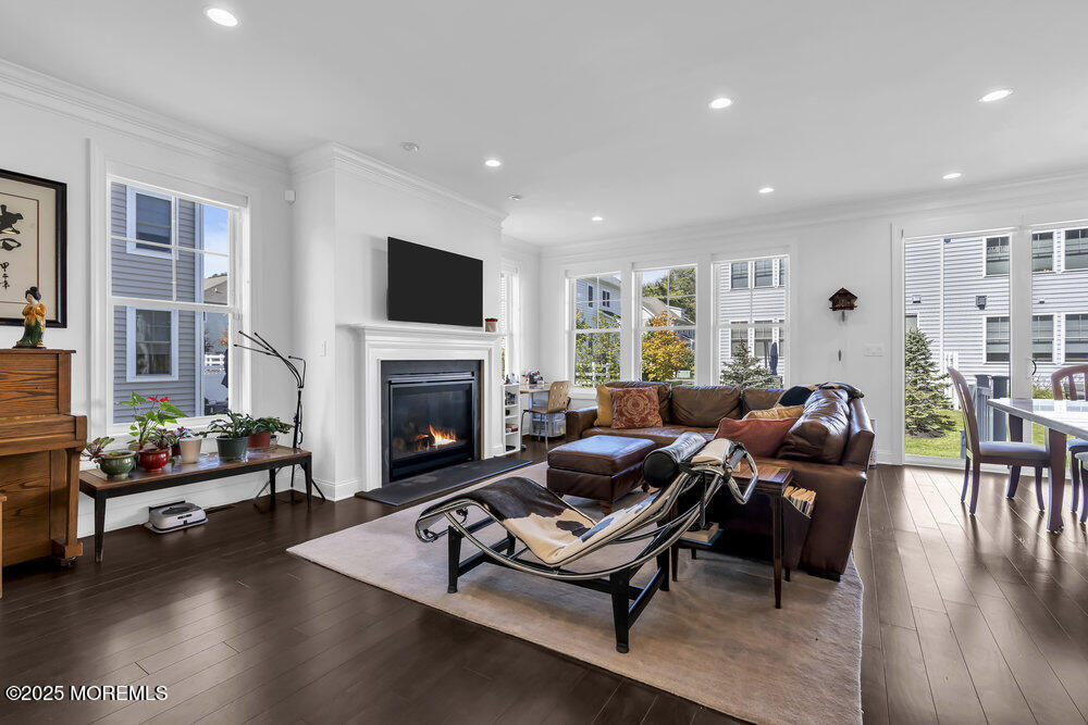 26 Malcolm Way Lincroft, NJ 07738 - Photo 8 of 44 a living room with furniture fireplace and flat screen tv