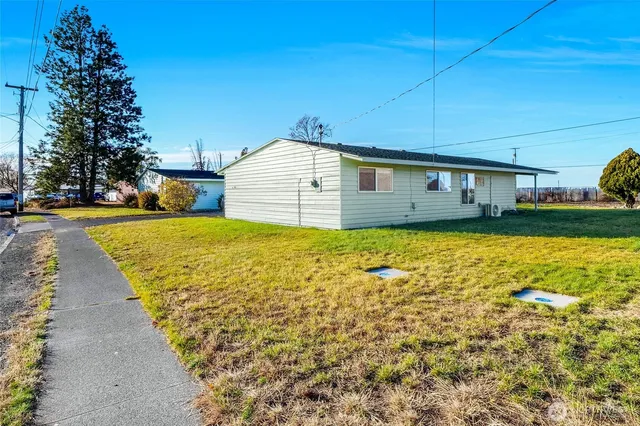 a bathroom with a sink mirror and bathtub